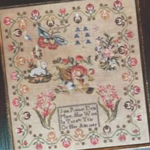 May include: Framed antique sampler reproduction featuring detailed cross-stitch embroidery. The sampler, with a dark wooden frame, showcases floral and animal motifs in a variety of colors. The text "Julia Rachel De La Mare, 1849" is visible. The image includes the text "Cross Stitch Antiques".