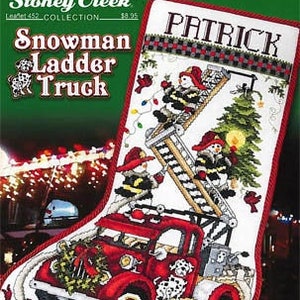 May include: A white Christmas stocking with a red border, featuring a snowman driving a red fire truck with a ladder. The stocking is personalized with the name "Patrick".