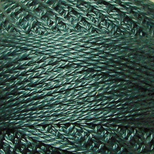 May include: Close-up of a ball of dark teal-colored crochet thread. The thread is tightly wound, showing the texture of the individual strands. The image highlights the thread's color and the woven pattern.