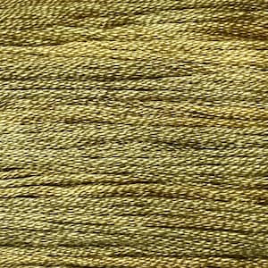 May include: A close-up of a spool of gold embroidery floss. The floss is tightly wound and has a subtle sheen.