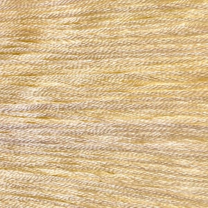 May include: Close-up of a skein of pale yellow embroidery floss. The threads are tightly wound and create a textured surface. The color is a soft, creamy yellow, with subtle variations in tone. Ideal for embroidery and other crafts.