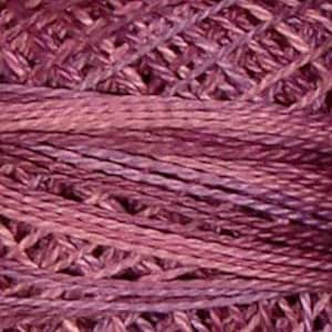 May include: A close-up of a skein of deep purple embroidery floss. The floss is made of a soft, textured cotton and has a subtle sheen.