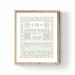 May include: A framed cross-stitch pattern with a gray and white color scheme. The pattern features a stylized Christmas tree, snowflakes, and the text "Frohes Fest 2021".