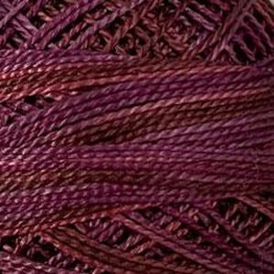 May include: Close-up of a skein of yarn in shades of purple, burgundy, and brown. The yarn appears to be tightly twisted, with visible texture and variations in color. The yarn is likely used for knitting or crocheting projects.