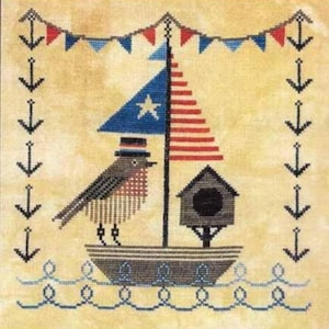May include: Cross-stitch design featuring a bird in a hat on a boat with a flag. The flag has red and white stripes and a blue star field. A birdhouse is also on the boat. The design is framed with anchors and a banner of red, white, and blue triangles.