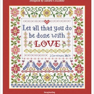 May include: Cross stitch pattern with a floral border and the text "Let all that you do be done with LOVE 1 Corinthians 16:14".
