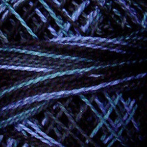 May include: A skein of yarn in shades of black, green, and purple. The yarn is a blend of fibers, creating a textured look.