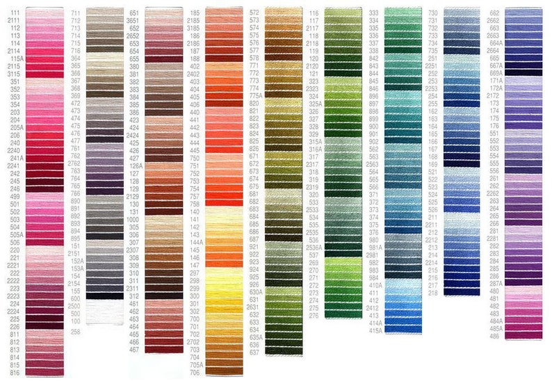 May include: A colour chart of DMC embroidery floss with hundreds of different colours organised in rows. The chart includes a variety of colours, including red, pink, blue, green, yellow, orange, brown, and purple.