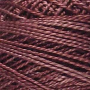 May include: A skein of deep burgundy colored yarn.