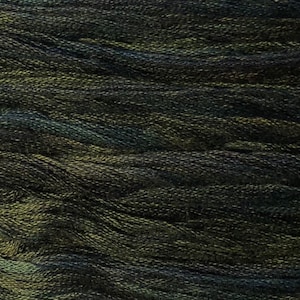May include: Close-up of a spool of dark green embroidery floss with a subtle shimmer.