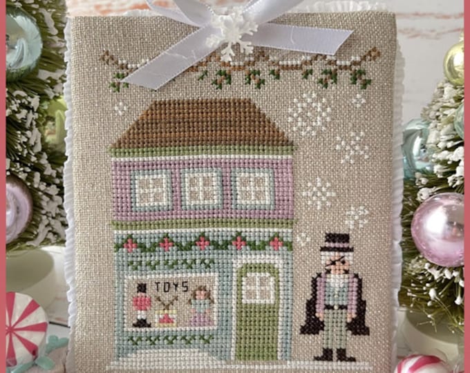 Featured listing image: Counted Cross Stitch, Nutcracker Village, Drosselmeyer's Toy Store, Christmas Decor, Country Cottage Needleworks, PATTERN ONLY