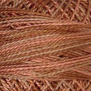 May include: A skein of variegated yarn in shades of brown and pink. The yarn is made of a blend of fibers, creating a unique and textured look.