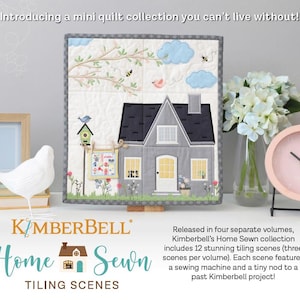 May include: A mini quilt collection featuring a house scene with a grey roof, blue sky, and a birdhouse. The quilt is displayed with a white bird figurine, a pink clock, and a vase of white flowers. The text reads "Kimberbell Home Sewn Tiling Scenes."