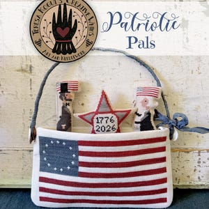 May include: A cross-stitch pattern titled Patriotic Pals by Teresa Kogut, featuring a rectangular pouch with an American flag design, containing three small stuffed figures: a star with 1776 and 2026, and two historical figures.