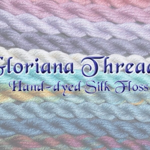 May include: A close-up of a variety of hand-dyed silk floss threads in different colors. The text "Gloriana Threads Hand-dyed Silk Floss" is visible in the center of the image.