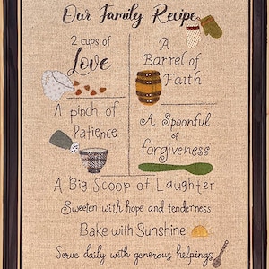 May include: A framed embroidery design with the text "Our Family Recipe" and a list of ingredients for a family recipe, including love, faith, patience, forgiveness, laughter, hope, tenderness, and sunshine.