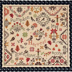May include: A framed cross-stitch sampler with a cream background and a black beaded frame. The sampler features autumn-themed motifs, including pumpkins, leaves, birds, and the words "Harvest", "Leaf", "Scarecrow", and "Acorn". The color palette includes red, orange, and brown.