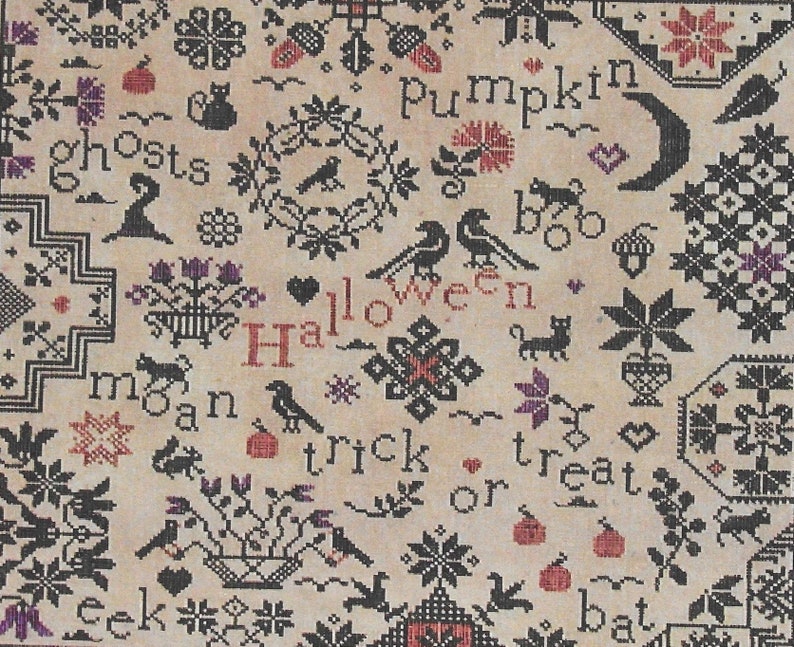 May include: A black and white cross-stitch sampler with a Halloween theme. The sampler features a variety of Halloween motifs, including pumpkins, bats, ghosts, cats, and crows. The text "Halloween", "trick or treat", "boo", "mean", "seek", and "bat" is included in the design.