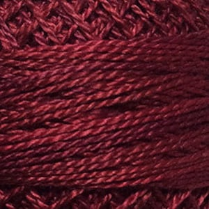 May include: A spool of deep red embroidery floss.