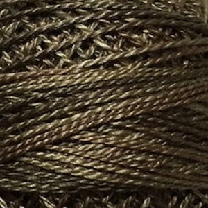 May include: A spool of brown and green embroidery floss.