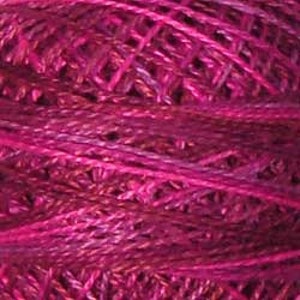 May include: A skein of deep pink yarn with a subtle shimmer. The yarn is made of a blend of fibers, creating a textured look.