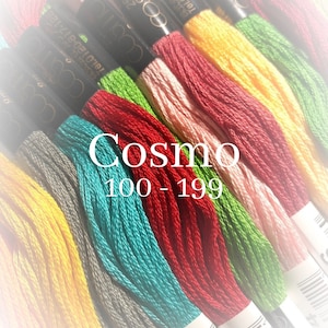 May include: A close-up of a variety of embroidery floss spools in different colors, including yellow, red, green, blue, and pink. The spools are labeled "Cosmo 100-199".