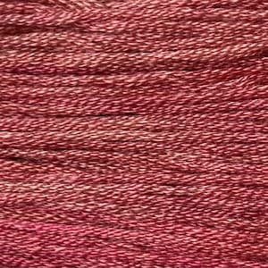May include: Close-up of a skein of yarn in shades of rose and white. The yarn appears to be tightly twisted, with a slightly textured surface. The color variation creates a subtle, blended effect, suitable for knitting or crochet projects.