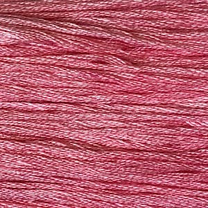 May include: Close-up of a skein of pink embroidery floss. The floss is a blend of pink and white threads, creating a textured appearance. The threads are tightly wound together, showing the detail of the individual strands.