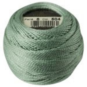 May include: A ball of light green embroidery floss with a label that reads "DMC - Perle 8 - Color 804".