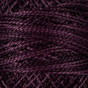 May include: A skein of deep purple yarn with a subtle shimmer. The yarn is made of a blend of fibers, creating a textured look.