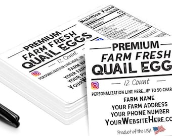 May include: A stack of white rectangular labels with the text "PREMIUM FARM FRESH QUAIL EGGS" in black. The labels include nutrition facts, social media icons, and space for farm details. A black and silver Sharpie pen is next to the labels.