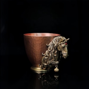 May include: A set of three ceramic mugs with a speckled, matte finish. The mugs are in shades of cream, light gray, and dark gray. Each mug has a simple, minimalist design and a rounded handle.