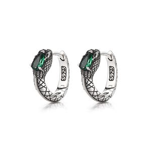 May include: A pair of silver hoop earrings featuring a textured snake-like design with a teardrop-shaped green stone set in the head. The metal surface has an oxidized finish to highlight the scale pattern, and each hoop is stamped with S925.