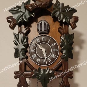 May include: A wooden cuckoo clock with a bird on top and decorative leaves. The clock face has Roman numerals and white hands. The clock is brown with dark green and brown accents. Two chains hang from the bottom.