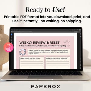 May include: A laptop screen shows a pink and white weekly review template with prompts for reflection. The text on the screen reads "WEEKLY REVIEW & RESET". The image also features the text "Ready to Use!" and "PAPEROX".