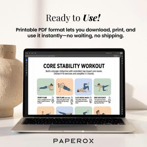 May include: A laptop displays a "Core Stability Workout" guide with exercise illustrations. The screen shows exercises like front plank, side plank, and bird dog reach. Text above reads "Ready to Use!" and "Printable PDF format". A beige vase is in the background.