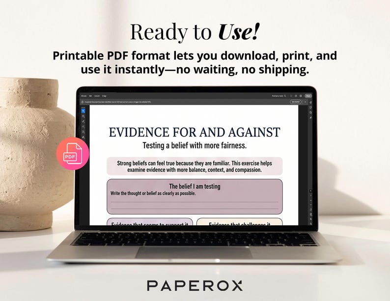 May include: A laptop displays a PDF document titled "EVIDENCE FOR AND AGAINST." The document guides users in testing beliefs with fairness. The laptop is open on a white surface, with a decorative vase to the left.