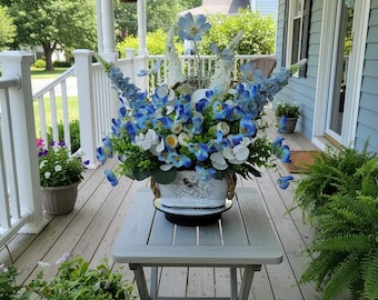 Beautiful Blue Pansy Country Silk Flower Arrangement in a Whitewashed Bucket Adorned with a Bird Emblem.