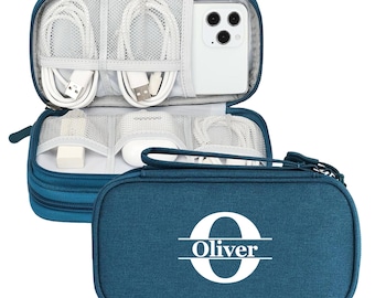 May include: Teal travel tech organizer with multiple compartments for cables, chargers, and a smartphone. The zippered case features the name "Oliver" with a large initial "O" in white on the front.