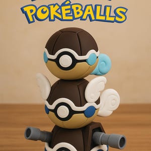 May include: A stack of brown, tan, and blue Pokémon Pokéballs with white detailing and wings. The image includes the text "Pokémon Pokéballs" in yellow and blue.