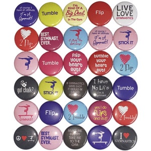 May include: A collection of 30 round buttons with various gymnastics-themed designs and text. The buttons feature phrases like "I'm a Gymnast!", "Tumble", "Flip", and "Live Love Gymnastics". Colors include red, pink, blue, and black.