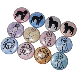 May include: A set of 10 round, colorful buttons featuring doodle-style illustrations of dogs. The buttons are approximately 1 inch in diameter and have a white background with watercolor-like designs in shades of blue, pink, yellow, and purple. Each button features a different dog breed, including a poodle, a golden retriever, and a labrador.