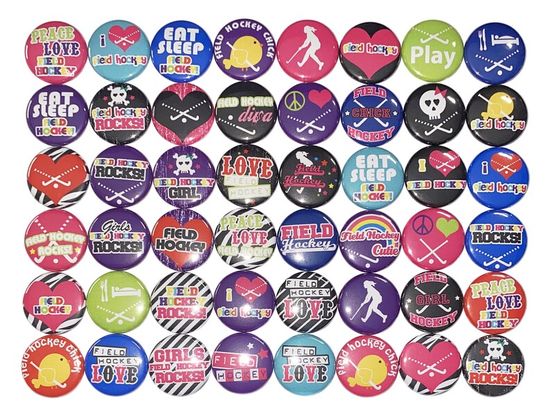 May include: A collection of 36 colorful round buttons with various field hockey-themed designs. The buttons feature text, graphics, and images related to field hockey, including the words "Field Hockey", "Love", "Peace", "Rocks", "Girl", "Cutie", and "Chic".