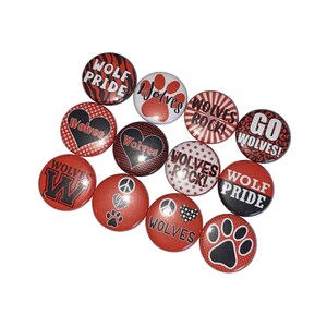May include: A collection of 12 red and black button pins with various designs and text, including "Wolf Pride", "Wolves Rock", and "Go Wolves!"