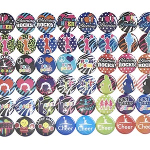 May include: A collection of 40 colorful round buttons with various cheerleading themes. The buttons feature different designs, including cheerleaders, pom-poms, and motivational slogans like "Cheering Rocks!" and "Eat Sleep Cheer!"