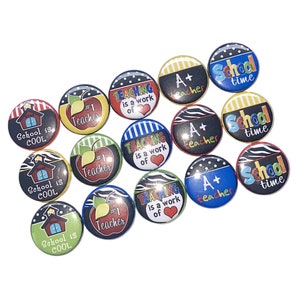 May include: A collection of 12 colorful round buttons with various school-themed designs. The designs include "School is Cool", "#1 Teacher", "Teaching is a work of heart", and "A+ Teacher".