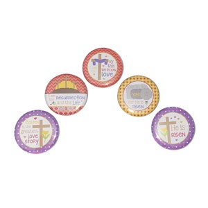 May include: Five round buttons with different Easter-themed designs. The buttons are purple, yellow, red, and pink with white polka dots. The text on the buttons includes "Easter is the greatest love story", "I am the resurrection and the life", "He is risen", "For He is risen", and "By this we know love".