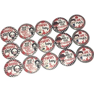 May include: A set of 12 round buttons with various designs featuring a cartoon character with a knife and red and black chevron patterns. The buttons have text that includes "Wanna play?" "What's your favorite scary movie?" "Mama's boy" and "The man of your dreams".