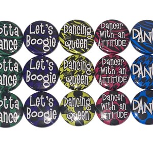 May include: Twelve 1-inch button pins with various dance-themed designs. The designs include "Gotta Dance", "Let's Boogie", "Dancing Queen", "Dancer with an Attitude", and "Dance" with different color backgrounds and patterns.