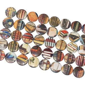 May include: A collection of round buttons featuring various images of books and book stacks. The buttons are colorful and have a vintage aesthetic.